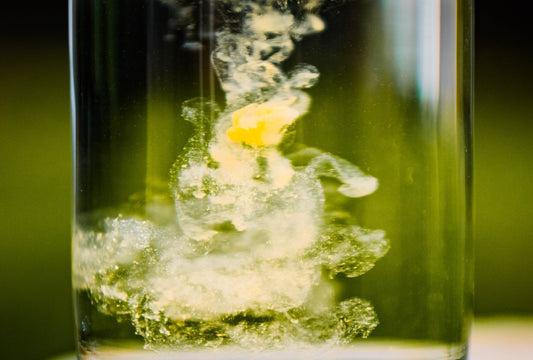 fulvic acid liquid diluting in clear water in a glass