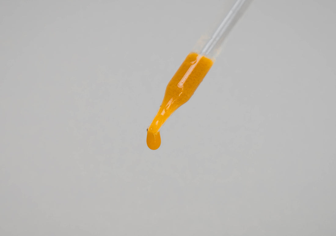 Colloidal Minerals coming out of a glass dropper