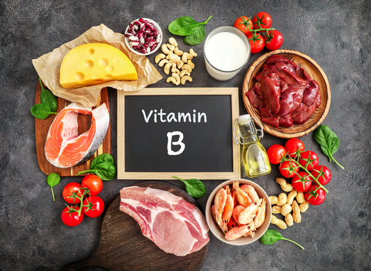 Sign that says b vitamins surrounded by b vitamin rich foods
