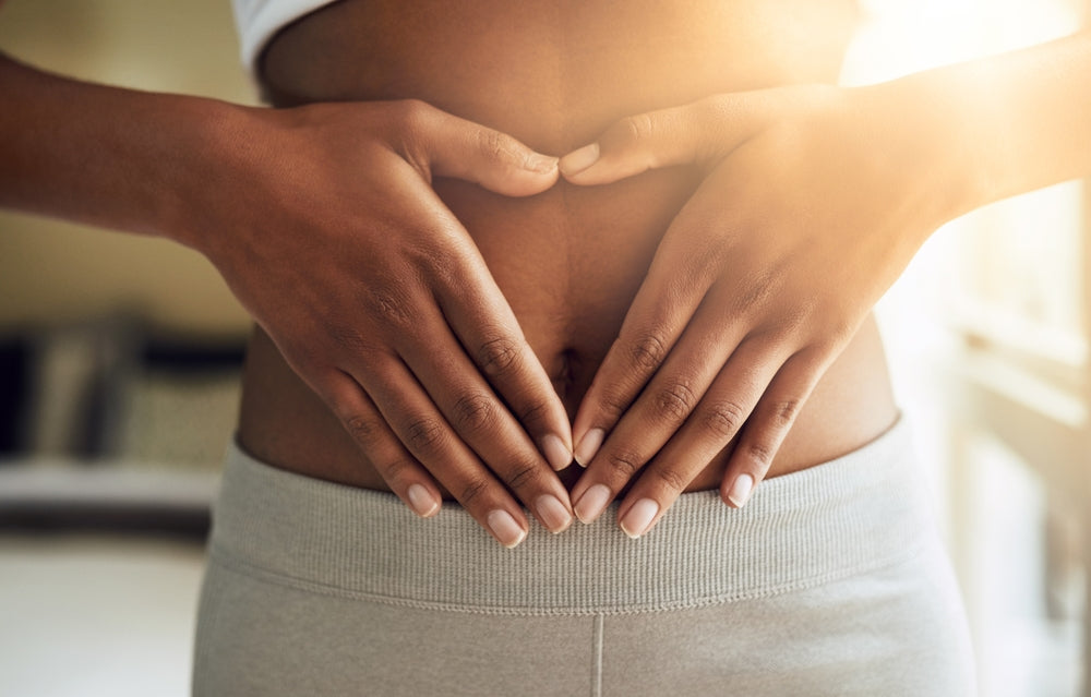 Hands of woman on stomach, diet and fitness for gut health
