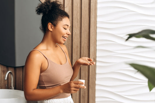 Happy young woman taking colostrum