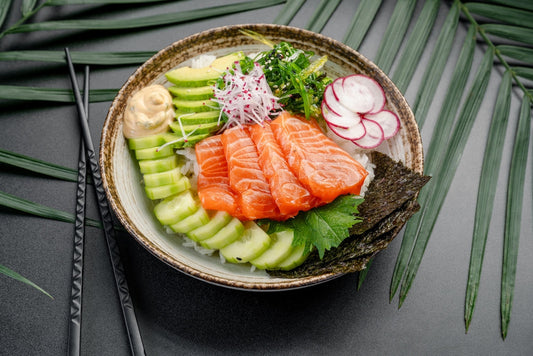 Salmon Poke Bowl with Avocado and Fresh Radish. 