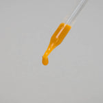 Orange drop of Zuma Nutrition Fulvic Acid & Trace Ocean Minerals on a dropper