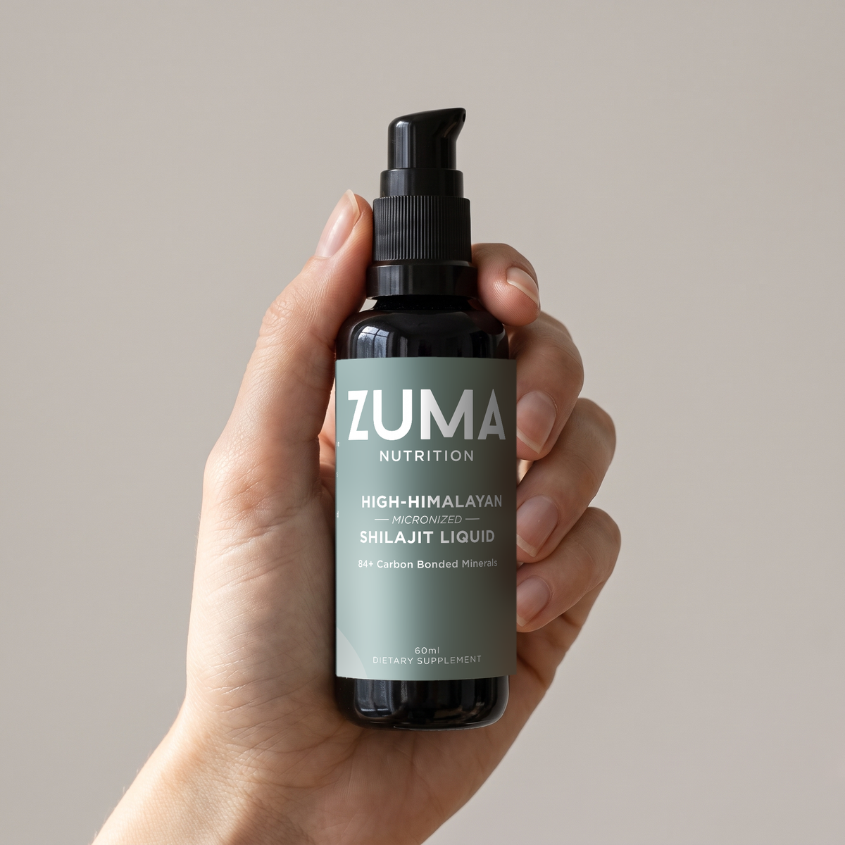 Zuma Nutrition High-Himalayan Shilajit Liquid bottle held in hand