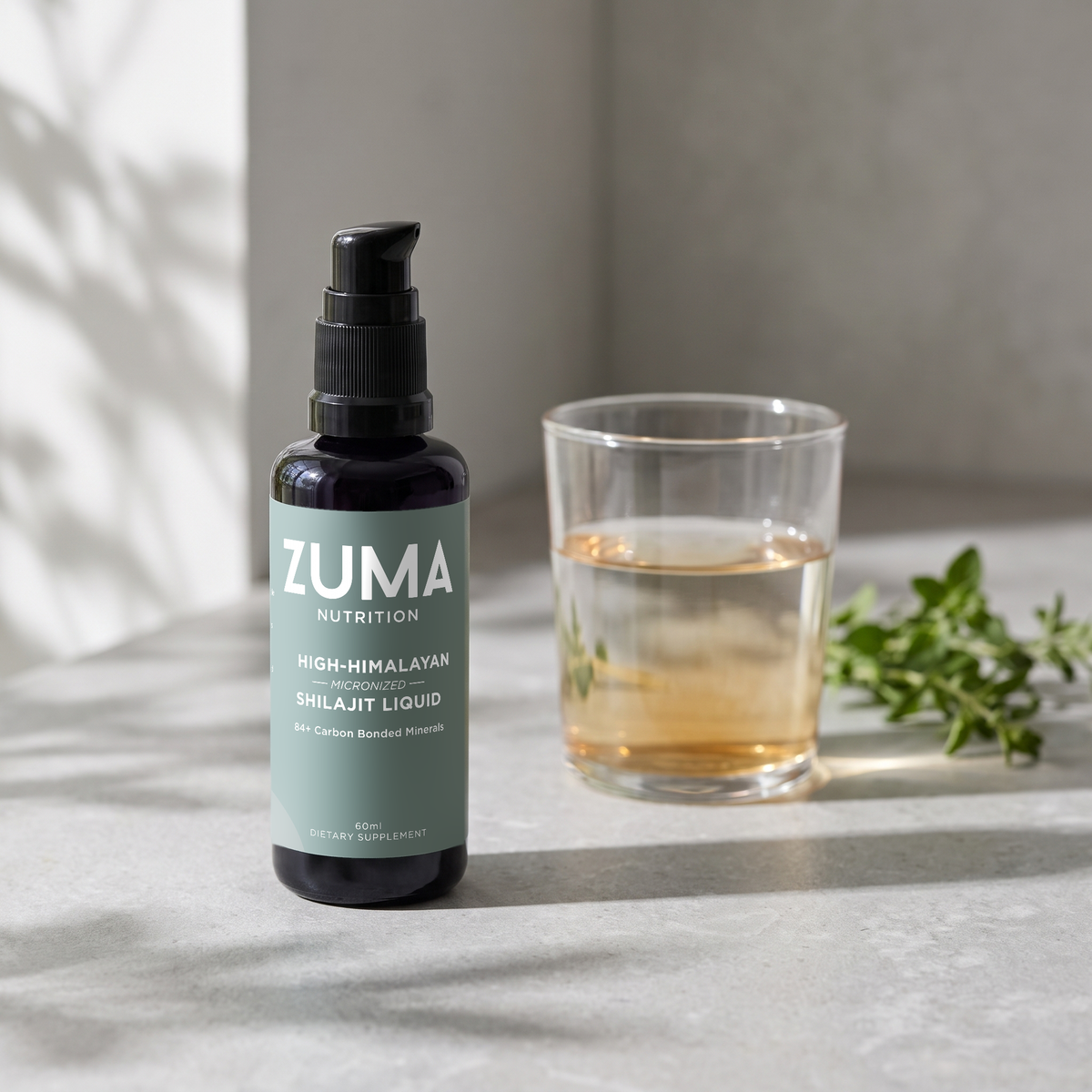 Zuma Nutrition High-Himalayan Shilajit Liquid in a morning routine with a glass of water
